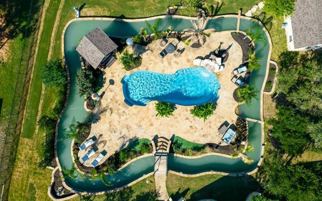 ​A lazy river is a water ride found in water parks, hotels, resorts, and recreation centers, which usually consists of a shallow (2.5-3.5-foot (0.76-1.07 m)) pool that flows similarly to a river. There is generally a slow current, usually just enough to allow guests to gently ride along lying on rafts. The current is generated by means of a gradual slope in the terrain, aided by a pumping mechanism that allows for the river to continue flowing infinitely. There may also be scenic elements added, such as small waterfalls on the edge of the river. Some connect or lead into swimming pools or wave pools, while others are self-contained courses that simply complete a circuit. ATPOOLS has built a lot of lazy river pool in Cebu, Bohol, Manila, Paranaque, Bulacan, Rizal, Laguna, Batangas, Palawan, Surigao, Boracay, Isabela, Baguio, Samar, Cavite and Quezon.